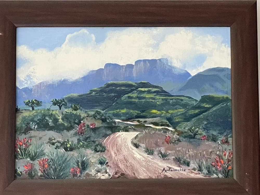 Painting of a winding dirt road through fynbos with red proteas and dramatic mountains