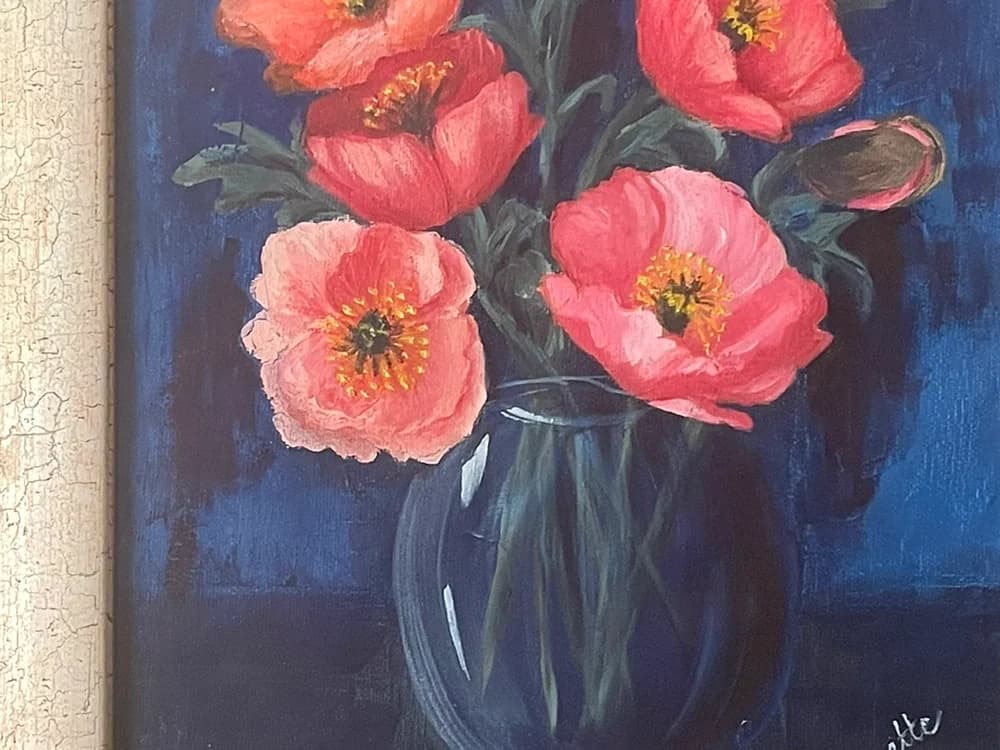 Painting of pink poppies in a clear glass vase against a deep blue background